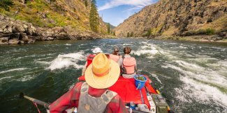 Guests rafting through whitewater on Idaho’s Main Salmon River during a specialty departure with Advocates for the West.